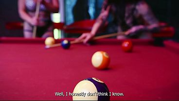 Two horny girls have sex with a stranger on a pool table.